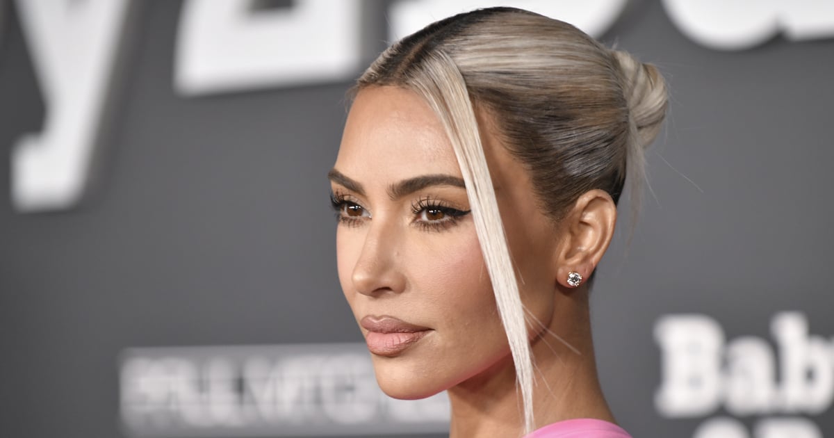 Kim Kardashian Stuns on Christmas in a Silver Versace Dress With a Thigh Slit